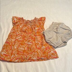 Orange and White Patterned Dress with Gray Shorts